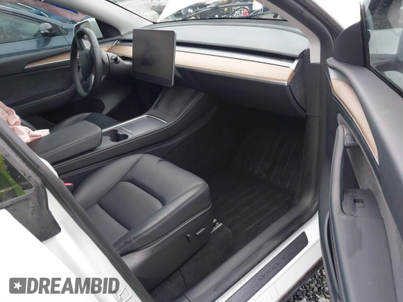 2023 Tesla Model Y Long Range with VIN 7SAYGDEE7PF809164, listed as a IAAI auction lot 41828974 with 31,772 mi miles. Bid and sale history available at carsss.com. Image 5.