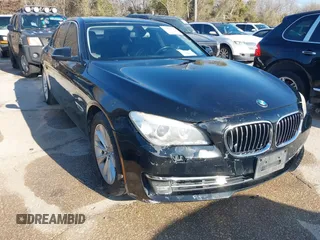 2013 BMW 7 Series 740i with VIN WBAYA6C55DC995094, listed as a IAAI auction lot 41246796 with 164,394 mi miles. Bid and sale history available at carsss.com. Image 1.