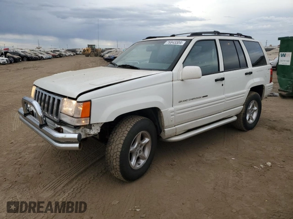 1998 Jeep Grand Cherokee Limited with VIN 1J4GZ88Z4WC164505, listed as a Copart auction lot 76843304 with 0 mi miles and Salvage Title. Bid and sale history available at carsss.com. Image 1.