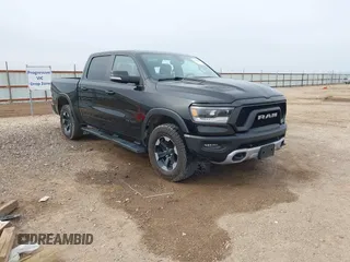 2020 Ram 1500 Rebel z VIN 1C6SRFLT5LN113514, wystawiony jako IAAI lot #41718662 z przebiegiem 56 730 mil mil oraz . Historia ofert i sprzedaży dostępna na DreamBid. Obrazek 1.