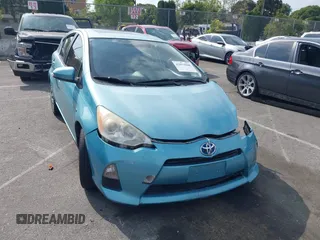 2012 Toyota Prius c One with VIN JTDKDTB37C1018497, listed as a IAAI auction lot 42073988 with 167,648 mi miles. Bid and sale history available at carsss.com. Image 1.