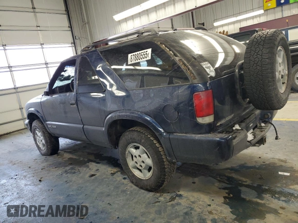 2000 Chevrolet Blazer LS z VIN 1GNCT18WXYK132399, wystawiony jako Copart lot #87880555 z przebiegiem 89 350 mil mil oraz Czysty tytuł • Clean title. Historia ofert i sprzedaży dostępna na DreamBid. Obrazek 2.
