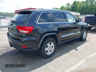 2011 Jeep Grand Cherokee Laredo with VIN 1J4RS4GG5BC534960, listed as a IAAI auction lot 42277395 with 223,690 mi miles and . Bid and sale history available at DreamBid. Image 4.
