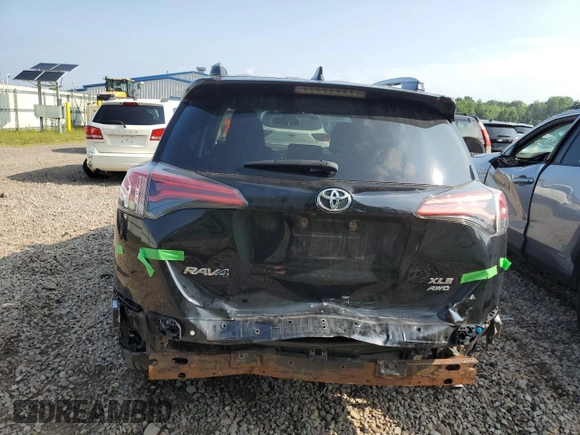 2018 Toyota RAV4 XLE with VIN 2T3RFREV0JW765995, listed as a Copart auction lot 63968785 with 114,598 mi miles and Salvage title. Bid and sale history available at DreamBid. Image 6.