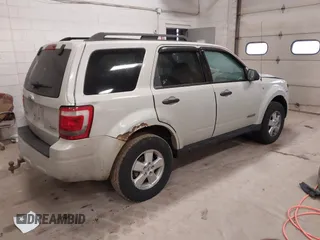 2008 Ford Escape XLT with VIN 1FMCU93128KC67338, listed as a IAAI auction lot 42099606 with 188,817 mi miles. Bid and sale history available at carsss.com. Image 4.