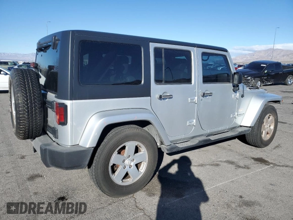 2007 Jeep Wrangler Unlimited Sahara with VIN 1J4GB59197L144781, listed as a Copart auction lot 48678315 with 137,538 mi miles and Salvage title. Bid and sale history available at DreamBid. Image 3.
