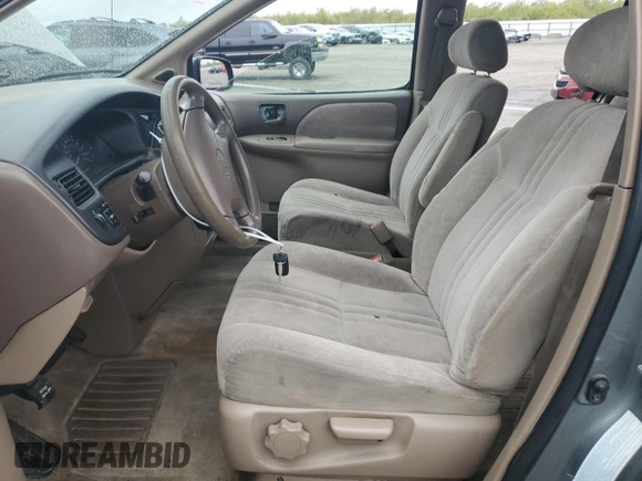 2000 Toyota Sienna LE with VIN 4T3ZF13C2YU217185, listed as a Copart auction lot 82407944 with 244,381 mi miles and Salvage Title. Bid and sale history available at DreamBid. Image 7.