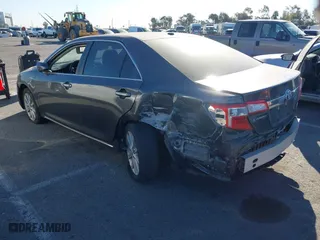 2014 Toyota Camry Hybrid LE with VIN 4T1BD1FK5EU106743, listed as a IAAI auction lot 41323019 with 84,511 mi miles. Bid and sale history available at carsss.com. Image 3.