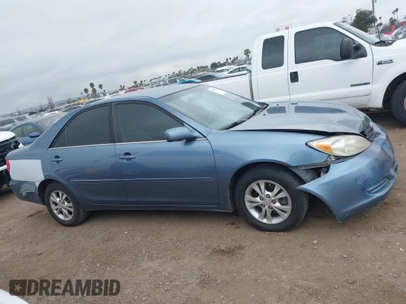 2004 Toyota Camry LE with VIN 4T1BF32K54U572537, listed as a IAAI auction lot 41850322 with 167,076 mi miles and . Bid and sale history available at DreamBid. Image 13.