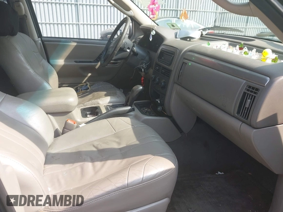 2004 Jeep Grand Cherokee Laredo with VIN 1J4GW48NX4C405558, listed as a IAAI auction lot 42440639 with 197,457 mi miles and . Bid and sale history available at DreamBid. Image 5.