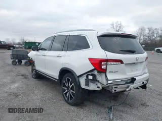 2020 Honda Pilot Touring 8-Passenger with VIN 5FNYF6H96LB056229, listed as a IAAI auction lot 41738249 with 65,099 mi miles and . Bid and sale history available at DreamBid. Image 3.