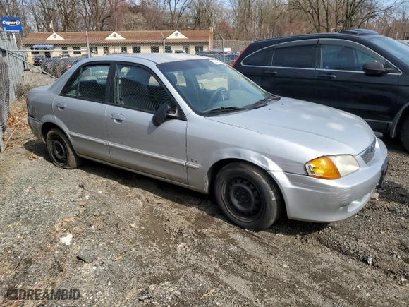 2000 Mazda Protege DX with VIN JM1BJ222XY0199683, listed as a Copart auction lot 50010565 with 139,428 mi miles and Salvage Title. Bid and sale history available at carsss.com. Image 4.