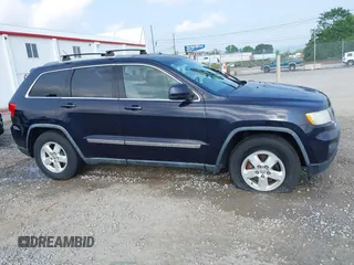 2011 Jeep Grand Cherokee Laredo with VIN 1J4RR4GG5BC622628, listed as a IAAI auction lot 42402893 with 163,731 mi miles and . Bid and sale history available at DreamBid. Image 14.