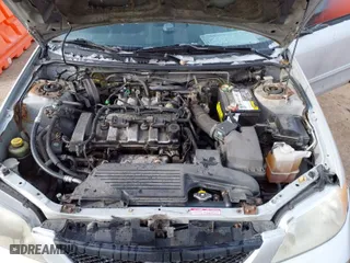 2003 Mazda Protege DX with VIN JM1BJ225830202261, listed as a IAAI auction lot 41273338 with 163,003 mi miles. Bid and sale history available at carsss.com. Image 10.