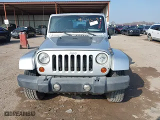 2012 Jeep Wrangler Unlimited Sahara with VIN 1C4HJWEG9CL146750, listed as a IAAI auction lot 41512678 with 94,952 mi miles. Bid and sale history available at carsss.com. Image 12.