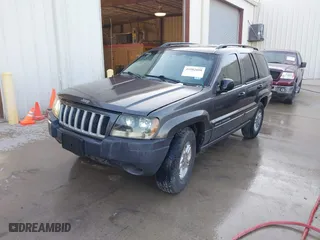 2004 Jeep Grand Cherokee Laredo with VIN 1J4GX48S04C394024, listed as a IAAI auction lot 41982608 with 142,825 mi miles. Bid and sale history available at carsss.com. Image 2.