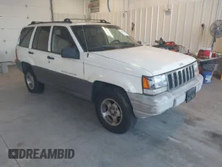 1997 Jeep Grand Cherokee Laredo with VIN 1J4GZ58SXVC552435, listed as a IAAI auction lot 41977888 with 143,832 mi miles. Bid and sale history available at carsss.com. Image 1.