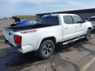 2017 Toyota Tacoma SR5 with VIN 3TMDZ5BN9HM029700, listed as a IAAI auction lot 42034375 with 86,907 mi miles. Bid and sale history available at carsss.com. Image 4.