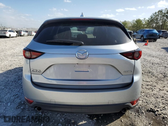 2021 Mazda CX-5 Grand Touring with VIN JM3KFADM8M1339008, listed as a Copart auction lot 49150115 with 144,851 mi miles and Salvage Title. Bid and sale history available at carsss.com. Image 6.