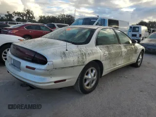 1999 Oldsmobile Aurora with VIN 1G3GR62C2X4107973, listed as a Copart auction lot 84023124 with 80,402 mi miles and Non Repairable. Bid and sale history available at DreamBid. Image 3.