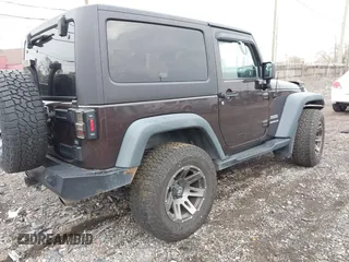 2013 Jeep Wrangler Sport with VIN 1C4AJWAG5DL679350, listed as a IAAI auction lot 40893582 with 61,191 mi miles and . Bid and sale history available at carsss.com. Image 4.