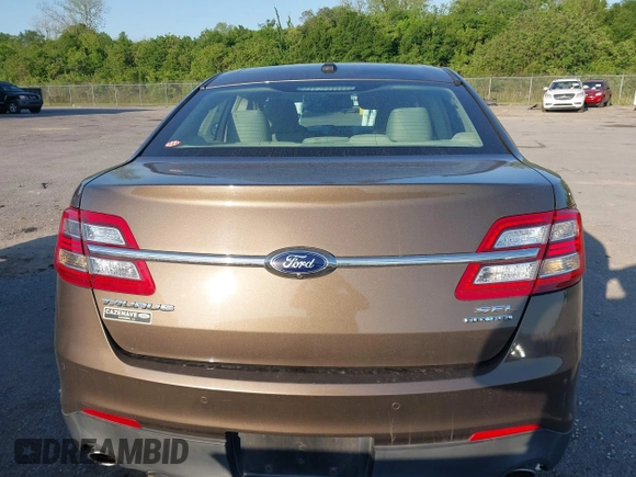 2015 Ford Taurus SEL z VIN 1FAHP2E84FG125243, wystawiony jako IAAI lot #42045847 z przebiegiem 42 093 mil mil oraz . Historia ofert i sprzedaży dostępna na DreamBid. Obrazek 16.