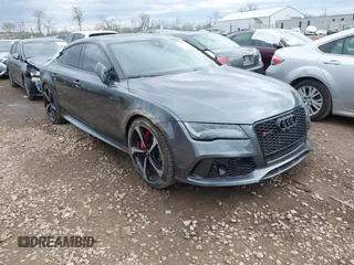 2015 Audi RS 7 Prestige z VIN WUAW2AFC7FN900677, wystawiony jako IAAI lot #42016755 z przebiegiem 51 524 mil mil oraz . Historia ofert i sprzedaży dostępna na DreamBid. Obrazek 1.
