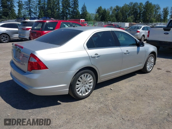 2012 Ford Fusion Hybrid z VIN 3FADP0L3XCR380817, wystawiony jako IAAI lot #42755712 z przebiegiem 81 220 mil mil oraz . Historia ofert i sprzedaży dostępna na DreamBid. Obrazek 4.