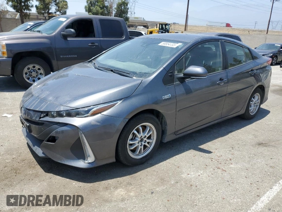 2021 Toyota Prius LE z VIN JTDKAMFPXM3174518, wystawiony jako Copart lot #58854495 z przebiegiem 83 445 mil mil oraz Szkoda całkowita • Salvage title. Historia ofert i sprzedaży dostępna na DreamBid. Obrazek 1.