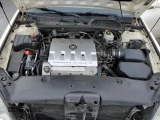 2002 Cadillac DeVille DHS z VIN 1G6KE57Y42U277428, wystawiony jako Copart lot #45757115 z przebiegiem 143 741 mil mil oraz Czysty tytuł • Clean title. Historia ofert i sprzedaży dostępna na DreamBid. Obrazek 11.