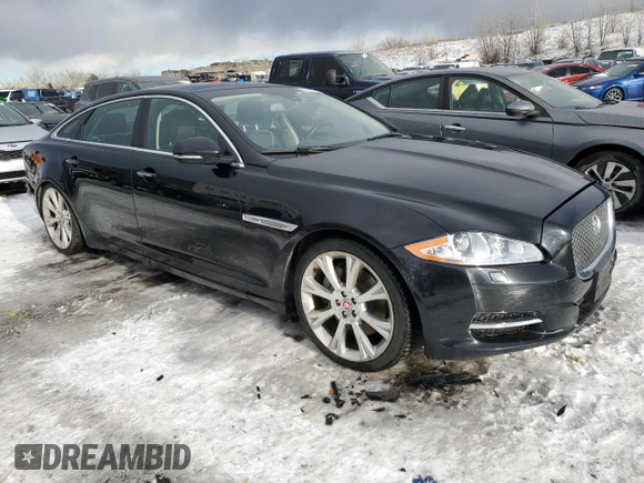 2015 Jaguar XJ Portfolio z VIN SAJWJ2GD4F8V79582, wystawiony jako Copart lot #42121395 z przebiegiem 65 017 mil mil oraz Szkoda całkowita • Salvage title. Historia ofert i sprzedaży dostępna na DreamBid. Obrazek 4.