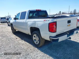 2017 Chevrolet Silverado 1500 LT with VIN 3GCUKREC3HG489701, listed as a IAAI auction lot 41814860 with 218,605 mi miles. Bid and sale history available at carsss.com. Image 3.