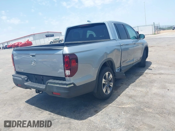 2018 Honda Ridgeline RTL z VIN 5FPYK2F5XJB001064, wystawiony jako IAAI lot #42252956 z przebiegiem 95 272 mil mil oraz . Historia ofert i sprzedaży dostępna na DreamBid. Obrazek 4.