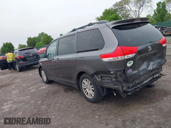 2014 Toyota Sienna XLE with VIN 5TDYK3DC0ES436502, listed as a IAAI auction lot 42180990 with 154,839 mi miles and . Bid and sale history available at DreamBid. Image 3.
