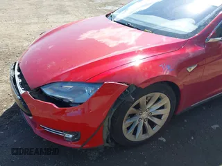 2014 Tesla Model S 60 with VIN 5YJSA1H11EFP37791, listed as a IAAI auction lot 41995504 with 84,371 mi miles and . Bid and sale history available at DreamBid. Image 6.