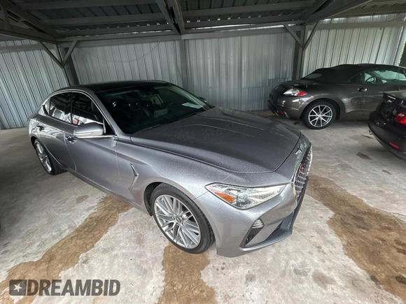 2021 Genesis G70 2.0T z VIN KMTG34LAXMU074866, wystawiony jako Copart lot #56966995 z przebiegiem 54 000 mil mil oraz Czysty tytuł • Clean title. Historia ofert i sprzedaży dostępna na DreamBid. Obrazek 1.