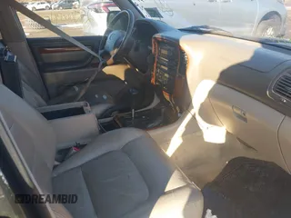 1999 Lexus LX 470 z VIN JT6HT00W9X0031151, wystawiony jako IAAI lot #41436144 z przebiegiem Nie podano mil oraz . Historia ofert i sprzedaży dostępna na DreamBid. Obrazek 5.