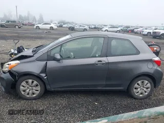 2013 Toyota Yaris L with VIN JTDJTUD39DD560766, listed as a IAAI auction lot 41031127 with 57,831 mi miles. Bid and sale history available at carsss.com. Image 14.