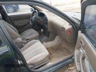 1996 Toyota Camry DX with VIN 4T1BG12K6TU754392, listed as a IAAI auction lot 42013697 with 172,410 mi miles. Bid and sale history available at carsss.com. Image 5.