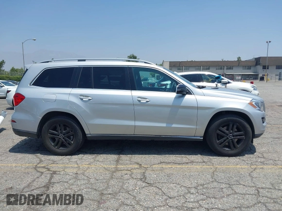2014 Mercedes-Benz GL 450 z VIN 4JGDF7CE9EA411572, wystawiony jako IAAI lot #42461631 z przebiegiem 121 885 mil mil oraz . Historia ofert i sprzedaży dostępna na DreamBid. Obrazek 13.