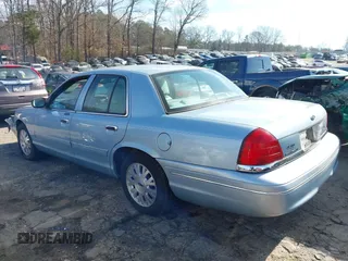2005 Ford Crown Victoria LX z VIN 2FAFP74W65X135964, wystawiony jako IAAI lot #41271175 z przebiegiem 82 494 mil mil oraz . Historia ofert i sprzedaży dostępna na DreamBid. Obrazek 14.