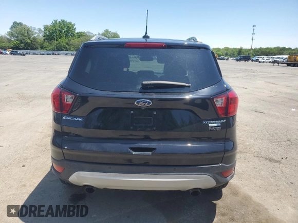 2019 Ford Escape Titanium с VIN 1FMCU9J91KUC57176, выставлен на аукционе Copart как лот 59131665 с пробегом Не указан миль и Списание • Salvage title. История ставок и продаж доступна на DreamBid. Изображение 6.