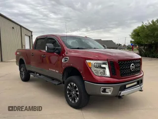 2016 Nissan Titan Pro-4X z VIN 1N6BA1F40GN516889, wystawiony jako Copart lot #72827234 z przebiegiem 123 706 mil mil oraz Czysty tytuł • Clean title. Historia ofert i sprzedaży dostępna na DreamBid. Obrazek 1.