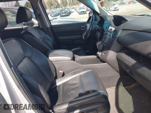2013 Honda Pilot EX-L with VIN 5FNYF4H71DB041562, listed as a IAAI auction lot 41819184 with 136,014 mi miles and . Bid and sale history available at DreamBid. Image 5.
