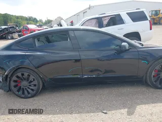 2021 Tesla Model 3 Performance with VIN 5YJ3E1EC5MF919278, listed as a IAAI auction lot 40194677 with 50,484 mi miles and . Bid and sale history available at carsss.com. Image 13.