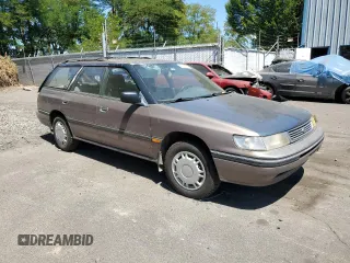 1993 Subaru Legacy L with VIN 4S3BJ6339P6948161, listed as a Copart auction lot 63123584 with 329,619 mi miles and Salvage Title. Bid and sale history available at DreamBid. Image 4.