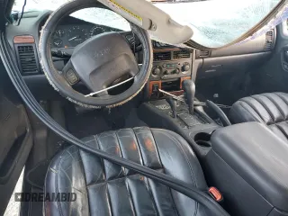 1999 Jeep Grand Cherokee Limited with VIN 1J4GW68S7XC676809, listed as a Copart auction lot 79059944 with 196,391 mi miles and Salvage Title. Bid and sale history available at carsss.com. Image 8.