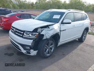 2018 Volkswagen Atlas SE z VIN 1V2FR2CA2JC540657, wystawiony jako IAAI lot #42115554 z przebiegiem 107 309 mil mil oraz . Historia ofert i sprzedaży dostępna na DreamBid. Obrazek 2.