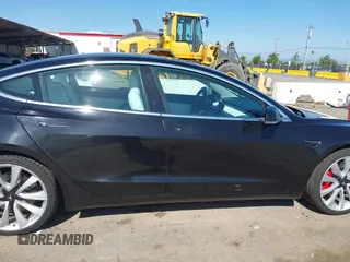 2019 Tesla Model 3 Long Range with VIN 5YJ3E1EB9KF231742, listed as a IAAI auction lot 42114608 with 86,657 mi miles and . Bid and sale history available at DreamBid. Image 14.