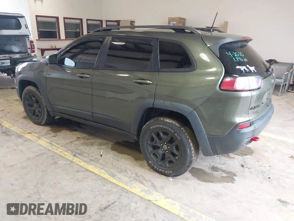 2020 Jeep Cherokee Trailhawk Elite with VIN 1C4PJMBN2LD538076, listed as a IAAI auction lot 42219282 with 53,773 mi miles and . Bid and sale history available at DreamBid. Image 3.